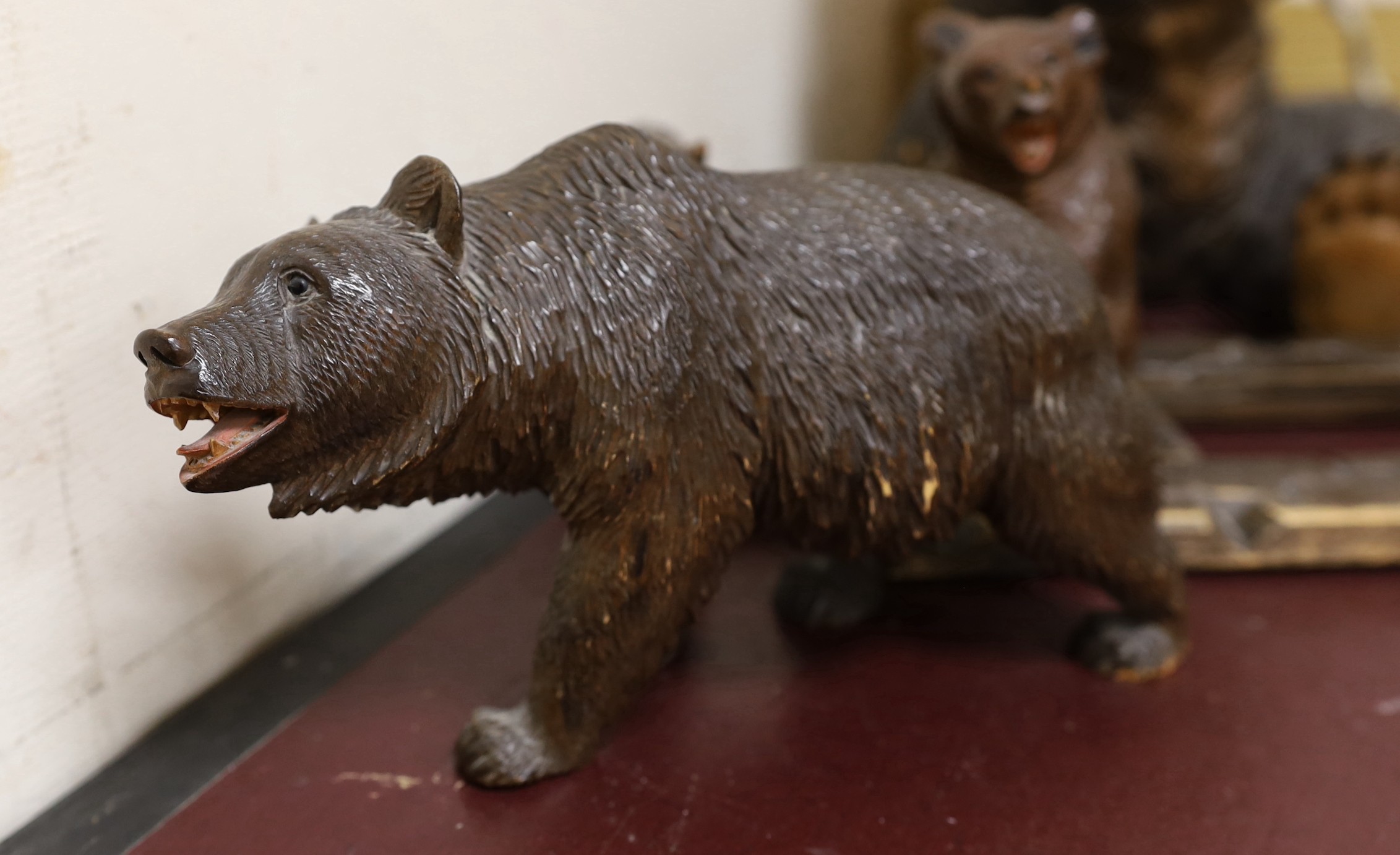 A group of Black Forest carved wood bears: a lamp, a book rack, etc.